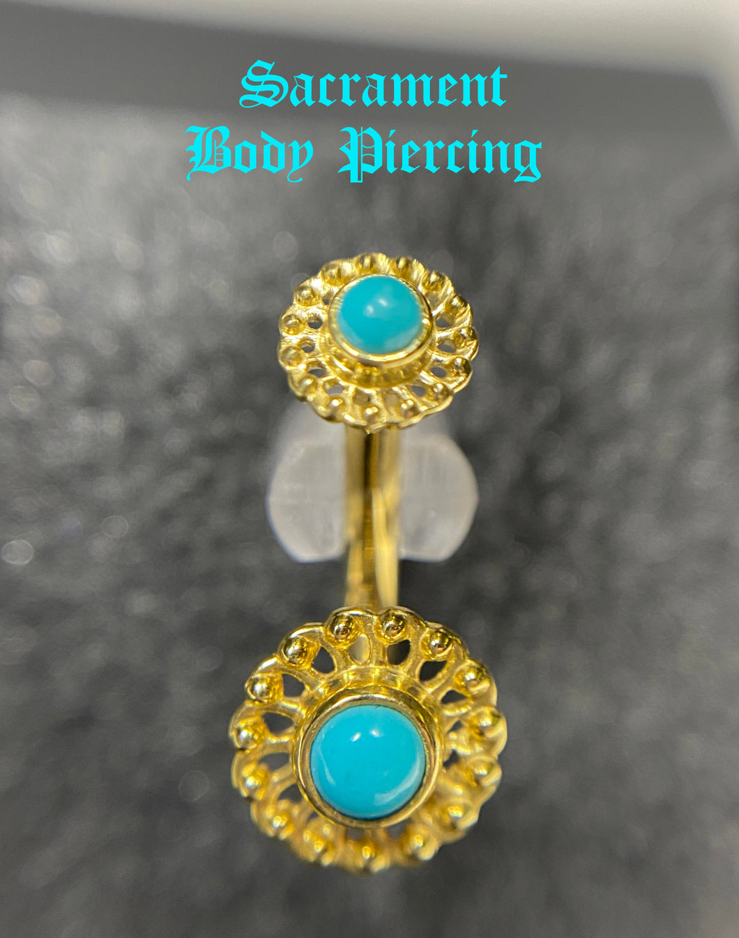Virtue navel or rook curved barbell featuring turquoise gems - gold